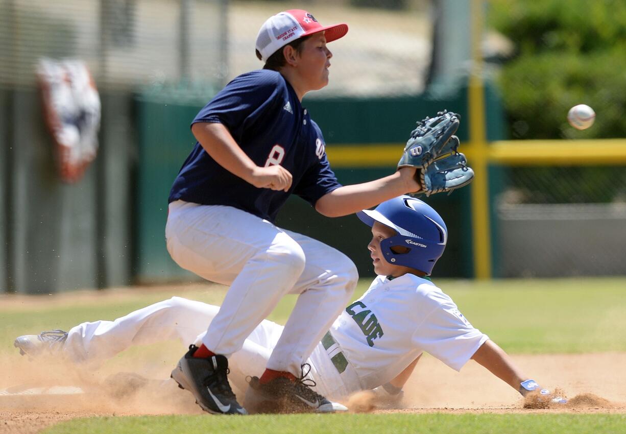 Cascade Little League's Isaac Hodory slides into third base ahead of the tag during the sixth inning of the Northwest Regional semifinal Friday in San Bernardino, Calif. Cascade lost to Wilshire-Riverside of Portland 10-6.