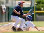 Cascade Little League's Isaac Hodory slides into third base ahead of the tag during the sixth inning of the Northwest Regional semifinal Friday in San Bernardino, Calif. Cascade lost to Wilshire-Riverside of Portland 10-6.