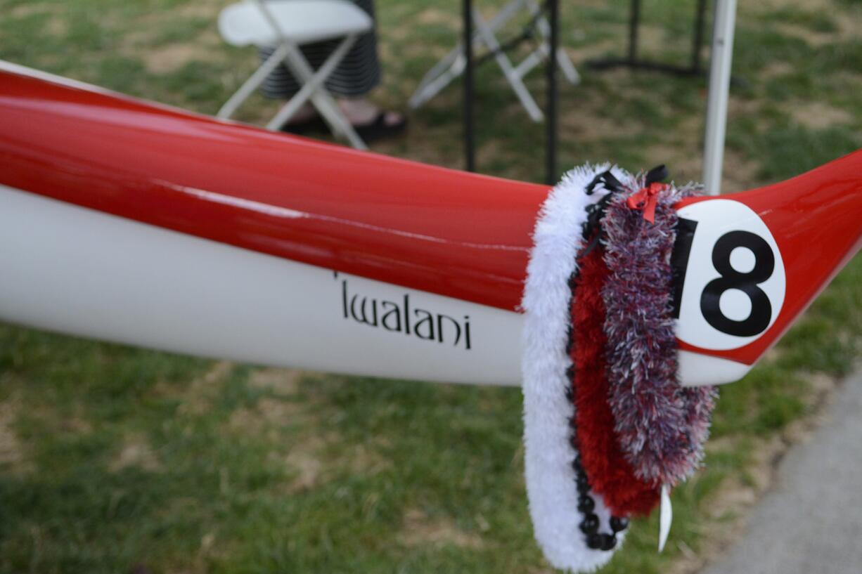 Leis hang over the end of the Iwalani, one of three canoes in the Columbia River Outrigger Canoe Club.