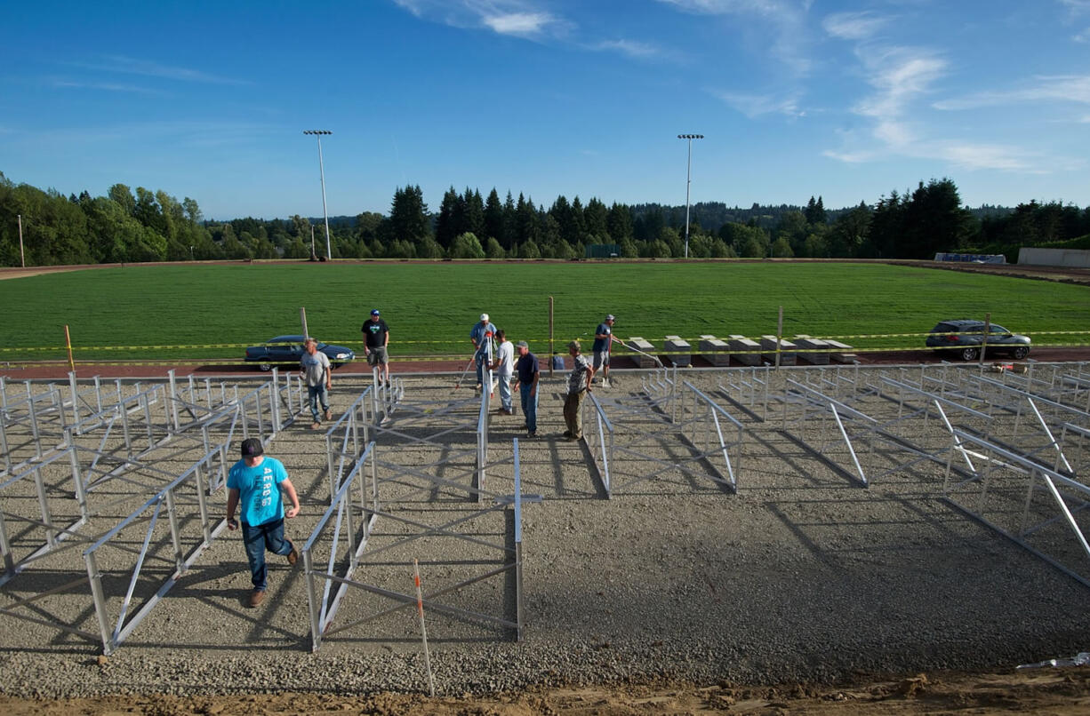 La Center High School students, staff, administrators and parents help with the construction of the new football stadium on Friday.