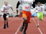 Emmanuel Huang of Vancouver won the 100 meters for boys ages 11-12 in the Hershey's Track and Field Program Washington State Meet held Saturday at McKenzie Stadium in Vancouver.