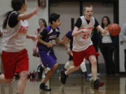 Daniel Barich, No. 20, starts a fast break for Fort Vancouver Unified.