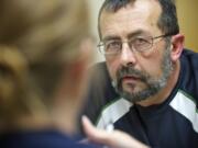 Stroke survivor Rick Dobson, 57, discusses his goals with speech language pathologist Jessica Vanasse last month at Legacy Salmon Creek Medical Center.