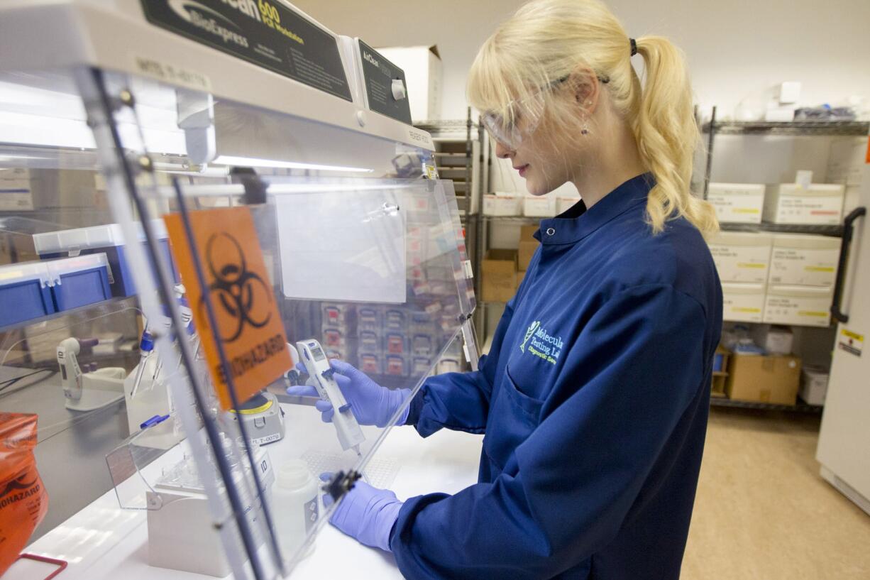 Laboratory technician Danielle Vellot at work Thursday morning at Molecular Testing Labs in Vancouver.