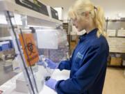 Laboratory technician Danielle Vellot at work Thursday morning at Molecular Testing Labs in Vancouver.