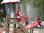 A lifeguard watches over swimmers at Klineline Pond.