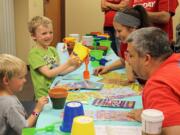 Central Vancouver: More than 70 volunteers from Keller Williams Realty spent the day at Innovative Services NW as part of Renew, Energize and Donate (RED) Day.