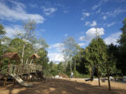 Two boys use the playground Friday at the newly built Chinook Neighborhood Park.