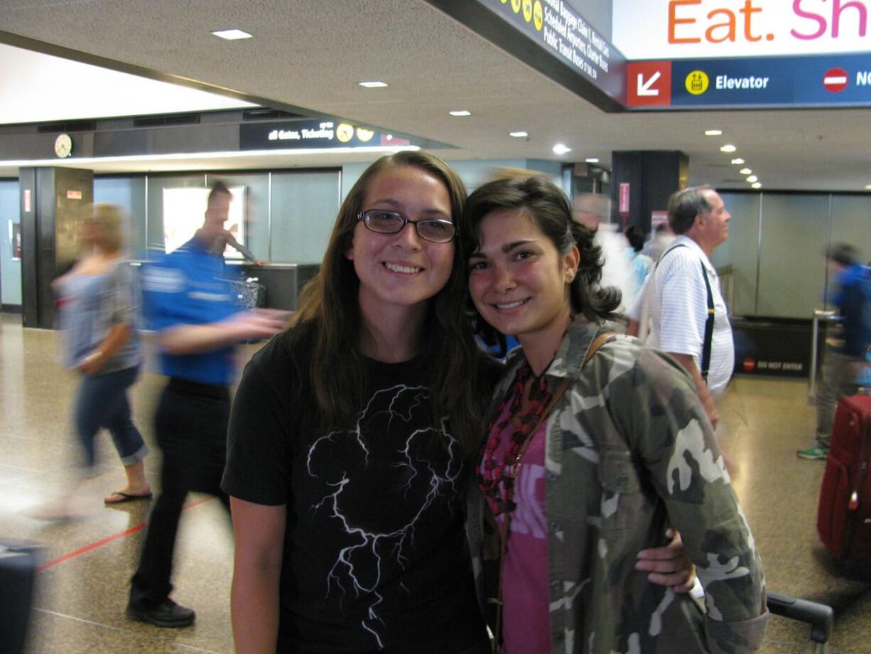 Brush Prairie: Rachel Willson, left, greets Italian exchange student Sara Cernuschi on Aug. 6.