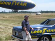 Vancouver Tire owner Gordon Bozarth with his Goodyear-inspired Chevrolet El Camino in Shelton on June 16, when he got to ride the blimp with his grandson, Carter Ziemer.