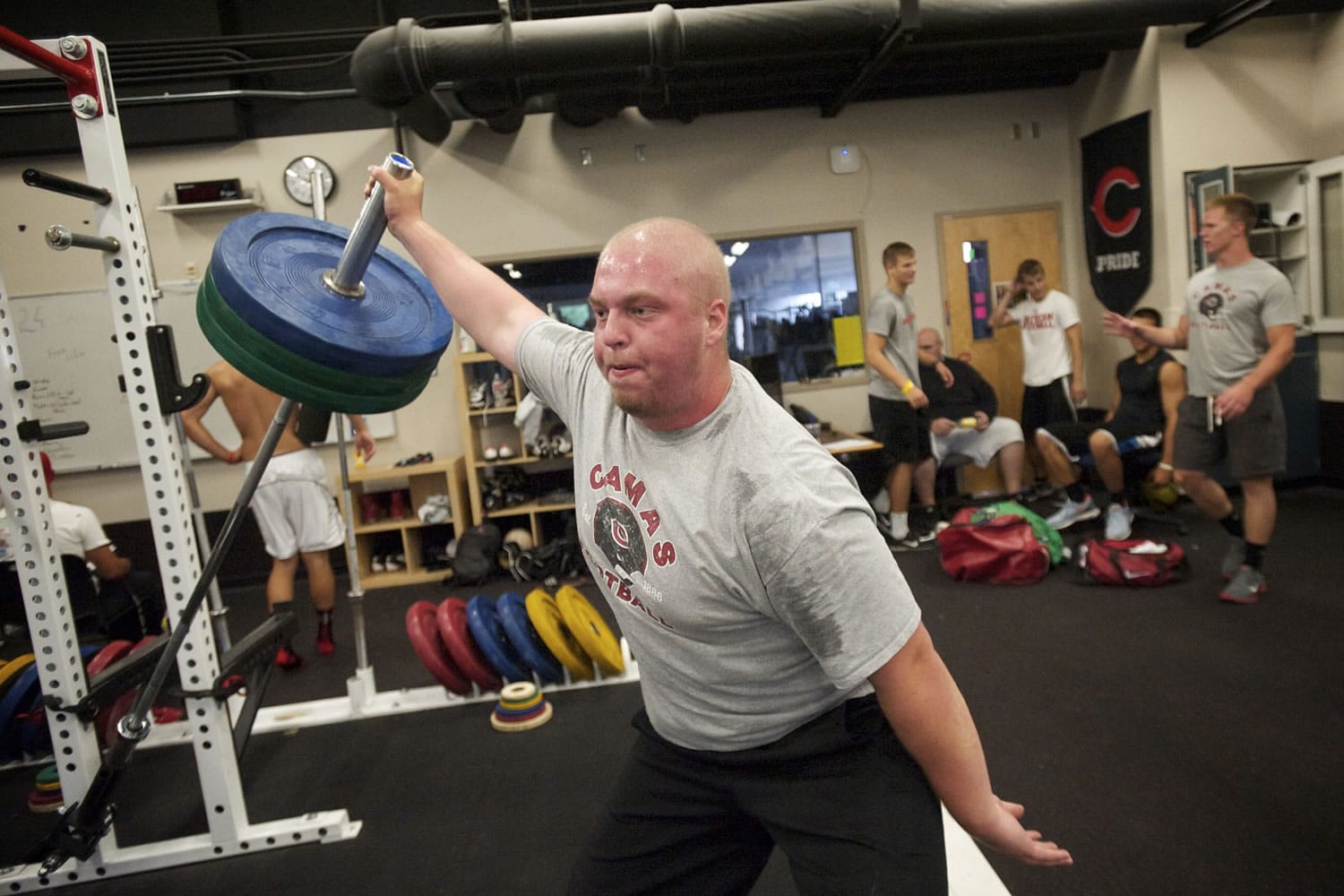 Camas offensive lineman Drew Clarkson trains in the weight room. Clarkson reportedly will play football at Oregon State.