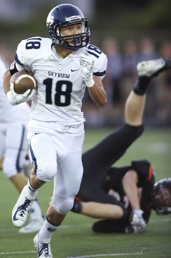 Skyview's Jefferson Kiyasu returns a punt against Battle Ground in the first quarter at District Stadium on Friday.