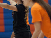 From left, Raigan Page, Shyanne Chandler and Paige Smith have each played varsity volleyball four years for Ridgefield.