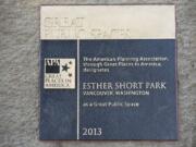 A plaque commemorating Esther Short Park's designation among Great Public Spaces was installed near the base of the bell tower in the downtown Vancouver park.