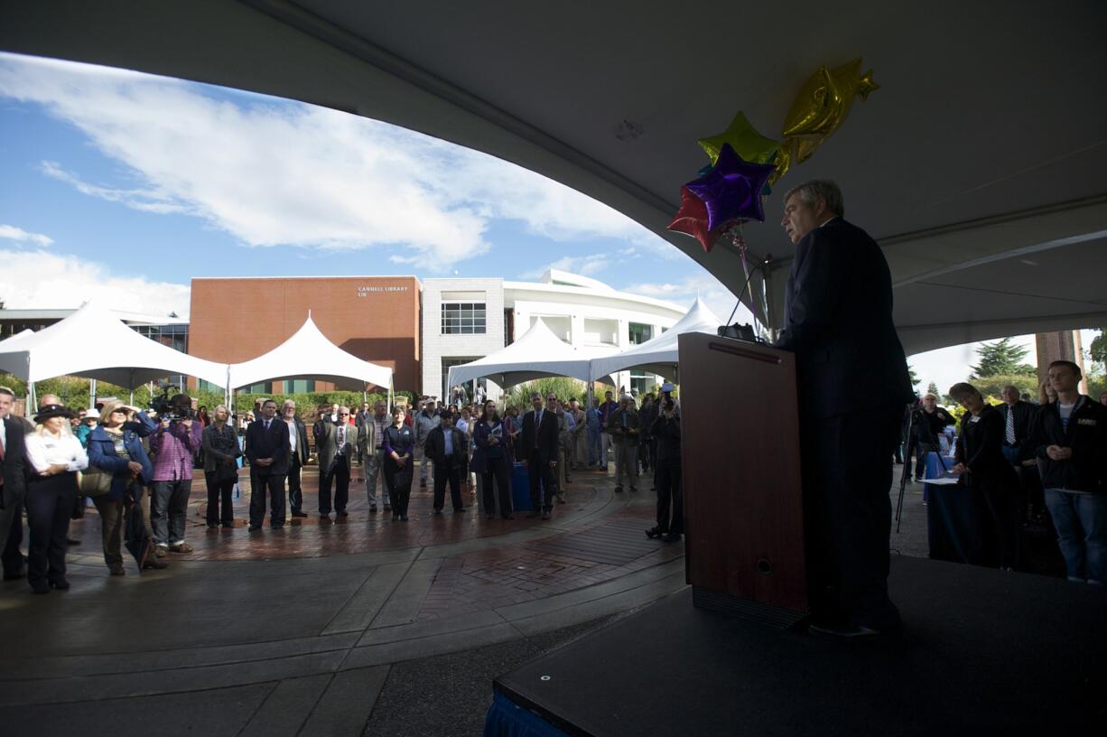 Clark College President Bob Knight reveals the amount of money raised during a five-year fundraiser in a ceremony Tuesday at the college.