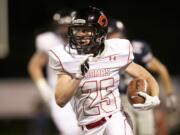 Camas running back Cole Zarcone carries the ball against Skyview at Kiggins Bowl, Friday, October 4, 2013.