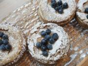 A brown butter tart with blueberries is served at the Bleu Door Bakery.