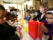 Gary and Michelle Fowler spend time with their five adopted children, from left, Jeramiah, 8; Cortana, 5; Daniel, 15; Elijah, 3; and Kara, 4. &quot;For a whole year we didn't get any sleep,&quot; Gary Fowler said.