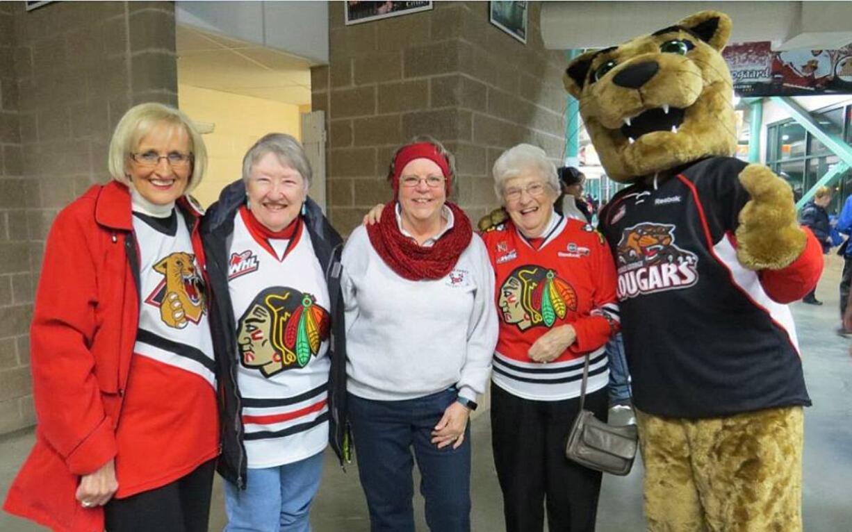 From left, a Prince George fan, Peggy Dale of Vancouver, Wash., Linda Barbee, Ardyce Moore and Cougars mascot Rowdy Cat.