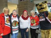 From left, a Prince George fan, Peggy Dale of Vancouver, Wash., Linda Barbee, Ardyce Moore and Cougars mascot Rowdy Cat.