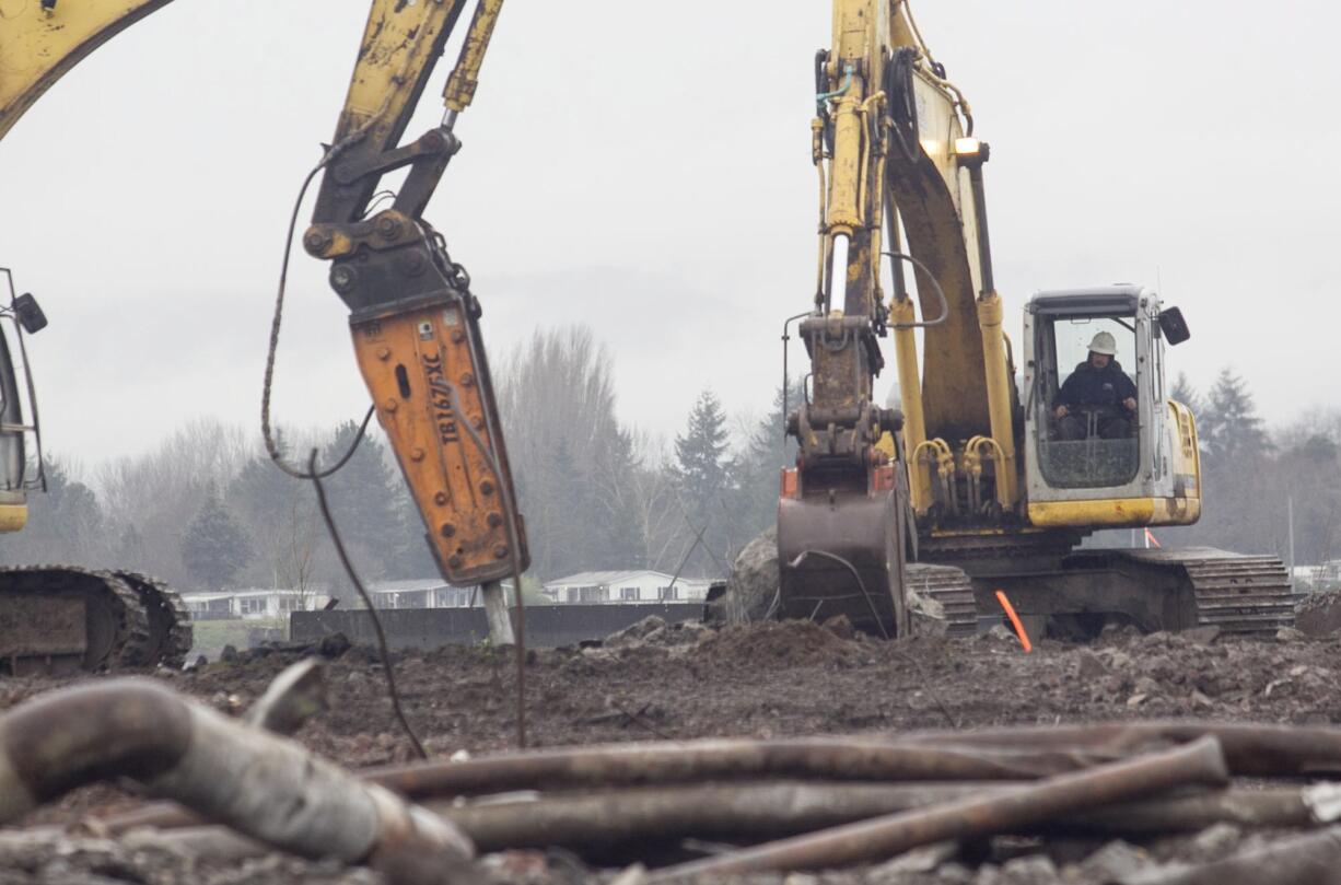 Crews work away on Feb. 5, as construction is just beginning on an extension of Columbia Way along the waterfront.