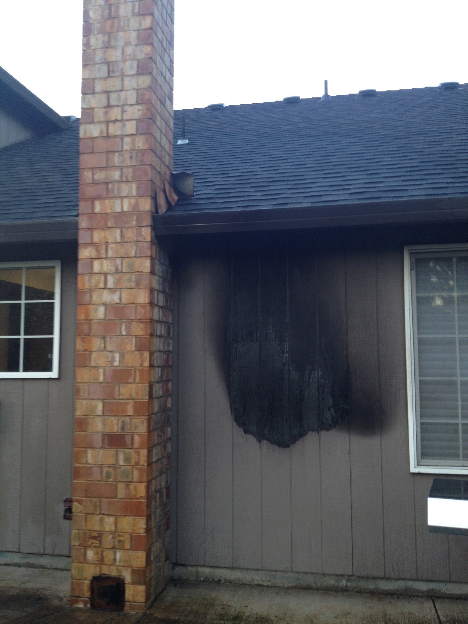 A fire from a propane barbecue spread to the side of a house in Battle Ground on Wednesday night.