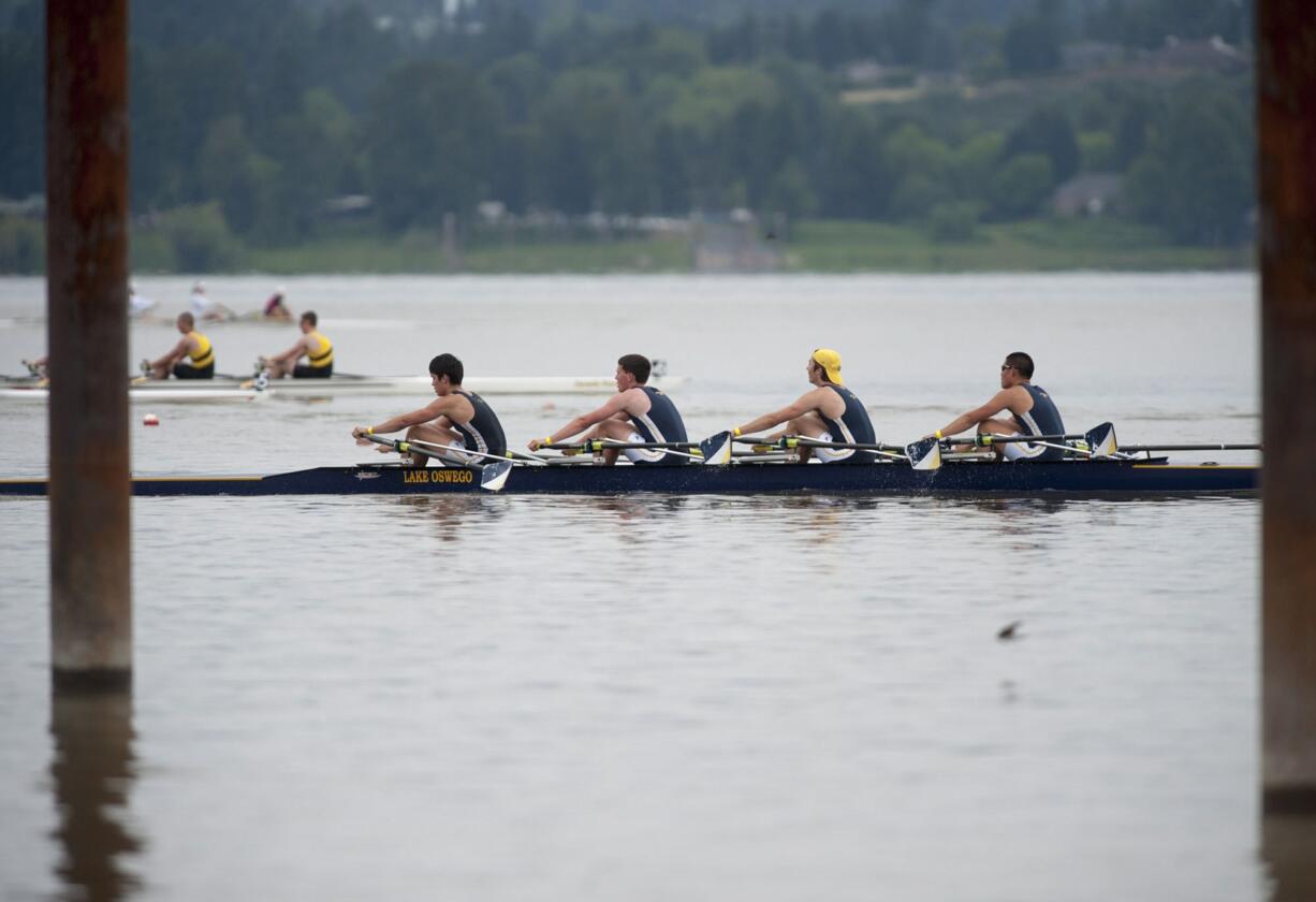 Crews teams row in races Friday on Vancouver Lake as part of the Pacific Northwest championships.