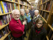 Vintage Books store owners Alec Milner, from left, and Becky Milner -- with Henry the cat -- along with guest author Kate Dyer-Seeley and employees Chris Milner, Pepper Parker and Finch Alder Hogue.