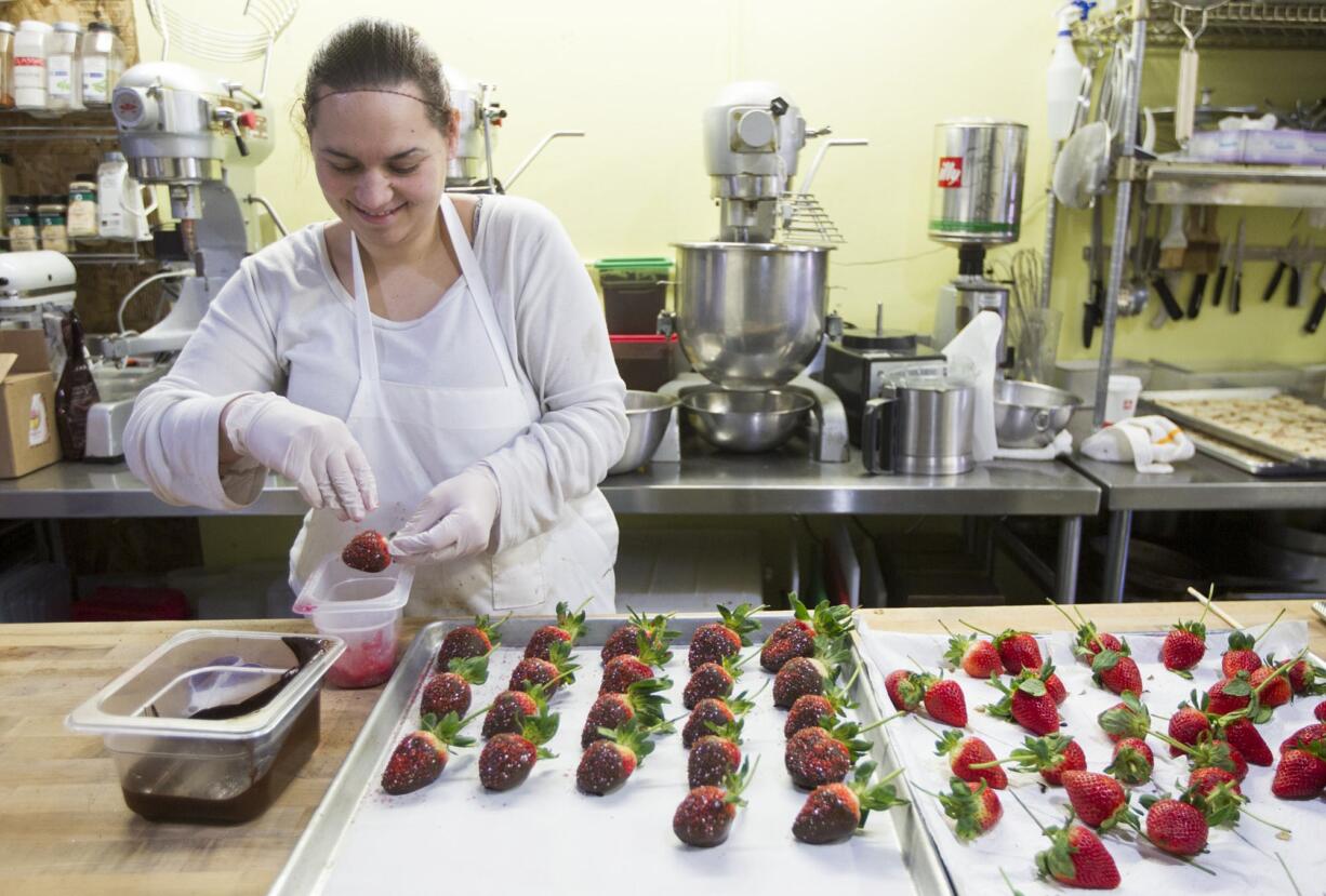 At Vancouver's Bleu Door Bakery, Kelly Conover devoted part of her Friday to preparing chocolate-covered strawberries.