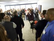 Gale Castillo, center, president of the Portland-based Hispanic Metropolitan Chamber, welcomes guests at an open house for the chamber's new office in the 805 Broadway Building in downtown Vancouver.