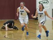 Skyview's Sydney Friauf (5) and Hannahjoy Adams (2) celebrate as Skyview beats Kentlake 54-53 at the Hardwood Classic Regional Round, on Saturday, Feb.