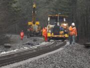 BNSF Railway workers make improvements to railroad trackage near Stevenson on Thursday.