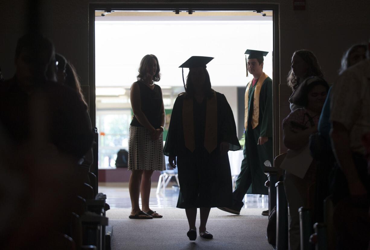 Graduates prepare to enter the auditorium Friday morning at the Washington State School for the Blind in Vancouver. The school, founded in 1886, had eight graduates this year.