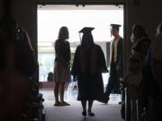 Graduates prepare to enter the auditorium Friday morning at the Washington State School for the Blind in Vancouver. The school, founded in 1886, had eight graduates this year.