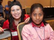 Fircrest: Charity Leitz, left, was one of five Audigy Group employees who traveled in late January to Cabo San Lucas, Mexico, to fit local people -- such as this 12-year-old girl -- with hearing aids.