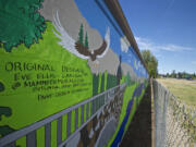 A mural on a storage building near the intersection of Northeast Fourth Plain Boulevard and Andresen Road was  designed by a local artist and painted by Peter S. Ogden Elementary School students to deter vandals. The Vancouver City Council will have a public hearing on tough new anti-graffiti laws on Aug.