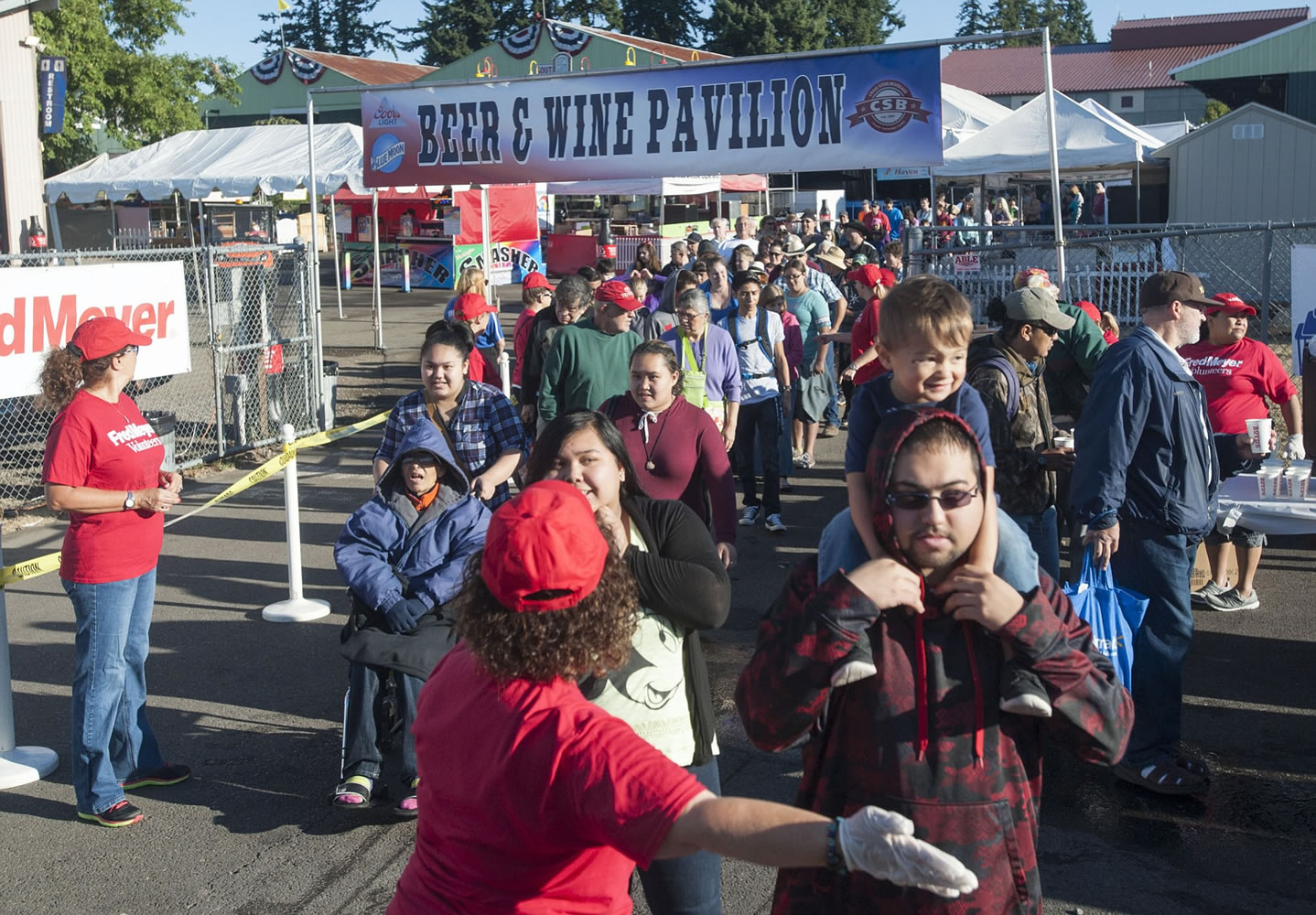 Throngs of people line up for free pancakes at the Clark County Fairgrounds in Vancouver Friday.