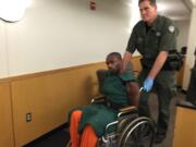 Gregory Antonio Wright, 34, of Vancouver is wheeled out of Clark County Superior Court on Friday after a judge ordered that he undergo a mental competency evaluation.