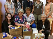 Central Vancouver: Legacy Health employees with some of the more than 40,000 pounds of food they collected for 11 local food banks.