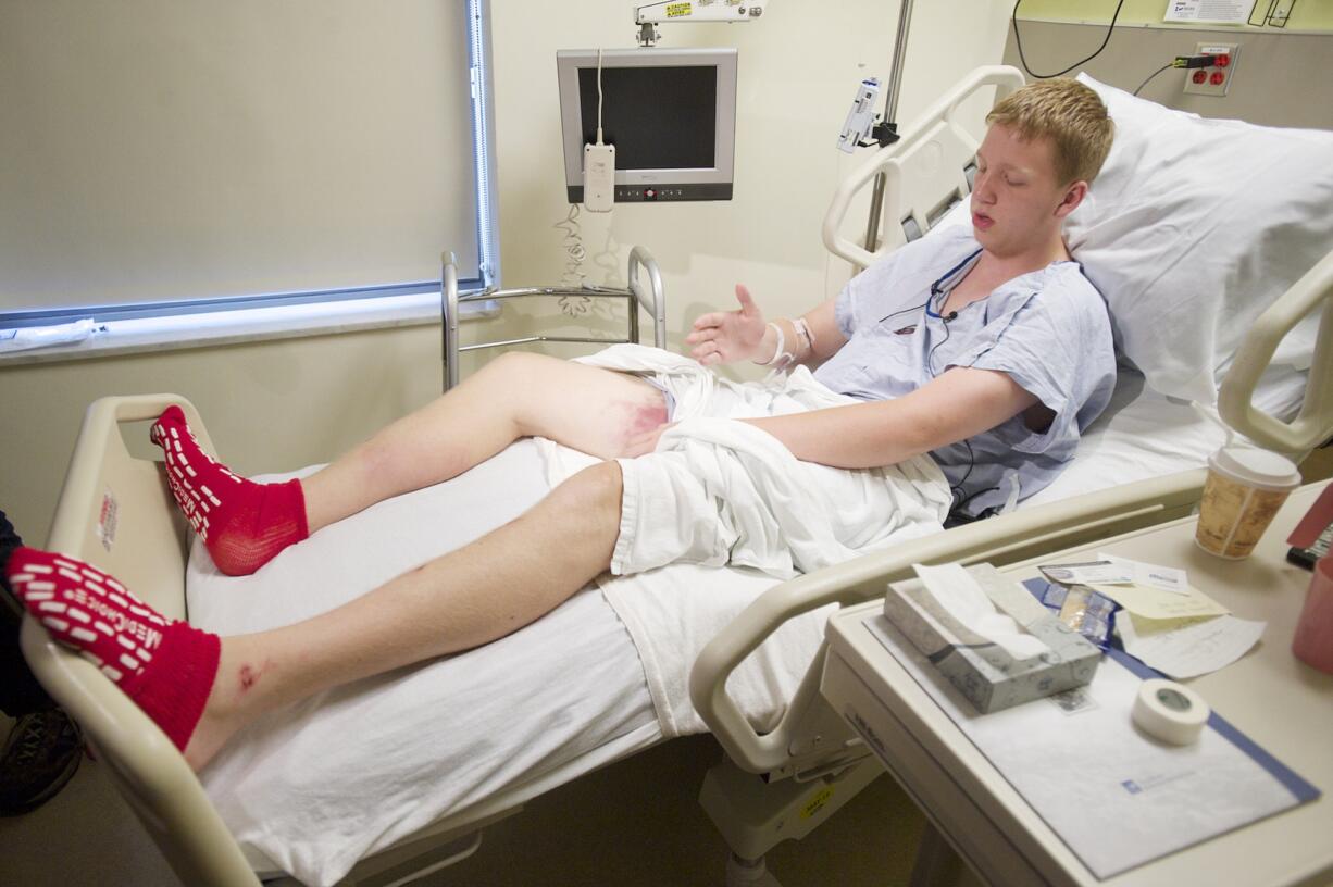 John Napierkowski, 19, from Washougal, recovers at PeaceHealth Southwest Medical Center on Tuesday, after being rescued from Dougan Falls on Monday night.