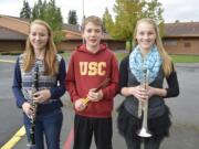 Washougal: Jemtegaard Middle School students Clara Harris, from left, Ian Palmer and Emily Johnson were selected to play in the Clark County Honor Band. They'll join other students on stage for a concert on Feb.