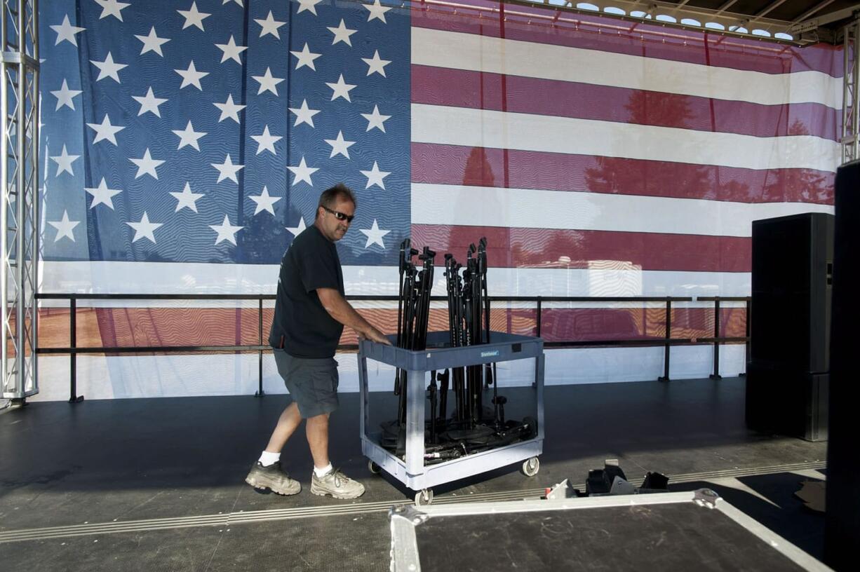 Darren Erickson of Woodland prepares the main stage for Independence Day festivities at Fort Vancouver on Friday.