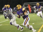 Columbia River's Nathan Hawthorne turns upfield on a pass reception against Garfield on Saturday at Kiggins Bowl.