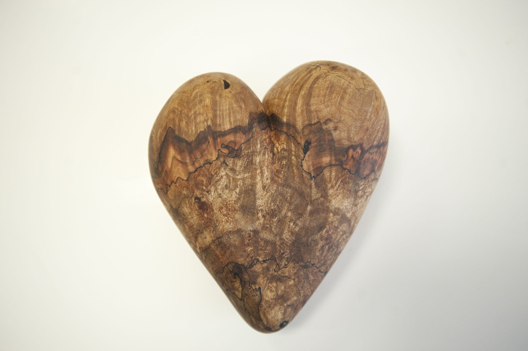 Max McBurnett crafted a wooden heart from an old maple burl.