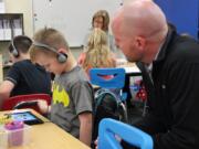 North Image: First-grade classes at North Image Elementary School received a donation of four iPad Minis from civil engineering firm MacKay Sposito, which the school will use as part of its reading program.