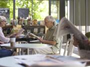 Al and Kathy Salle take time to read at the Vancouver Community Library.