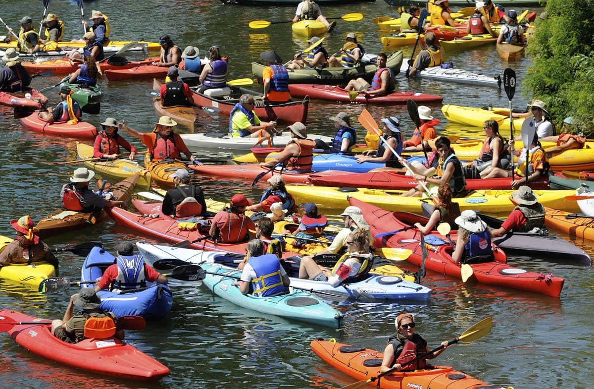 Protesters gather prior to an amphibious demonstration at the Interstate bridge against proposed fossil fuel facilities in the Northwest, in Vancouver, Wa., Saturday July 27, 2013.