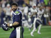 Seattle Seahawks quarterback Russell Wilson (3) looks back after throwing an interception to New England Patriots strong safety Malcolm Butler during the closing seconds of the fourth quarter of Super Bowl XLIX on Sunday, Feb.