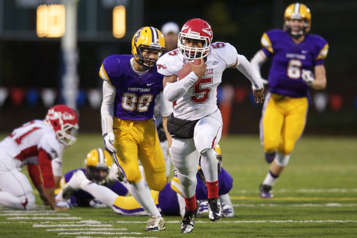 Marysville Pilchuck running back Austin Joyner carries the ball against Columbia River in the 3A state quarterfinal game at Kiggins Bowl, Saturday, November 22, 2014.