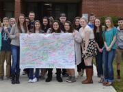 Ridgefield: Ridgefield High School language arts students wrote essays on the American Dream, taking key words and phrases from each others' essays and putting them on large poster boards, which illustration students used as inspiration to create works of art.